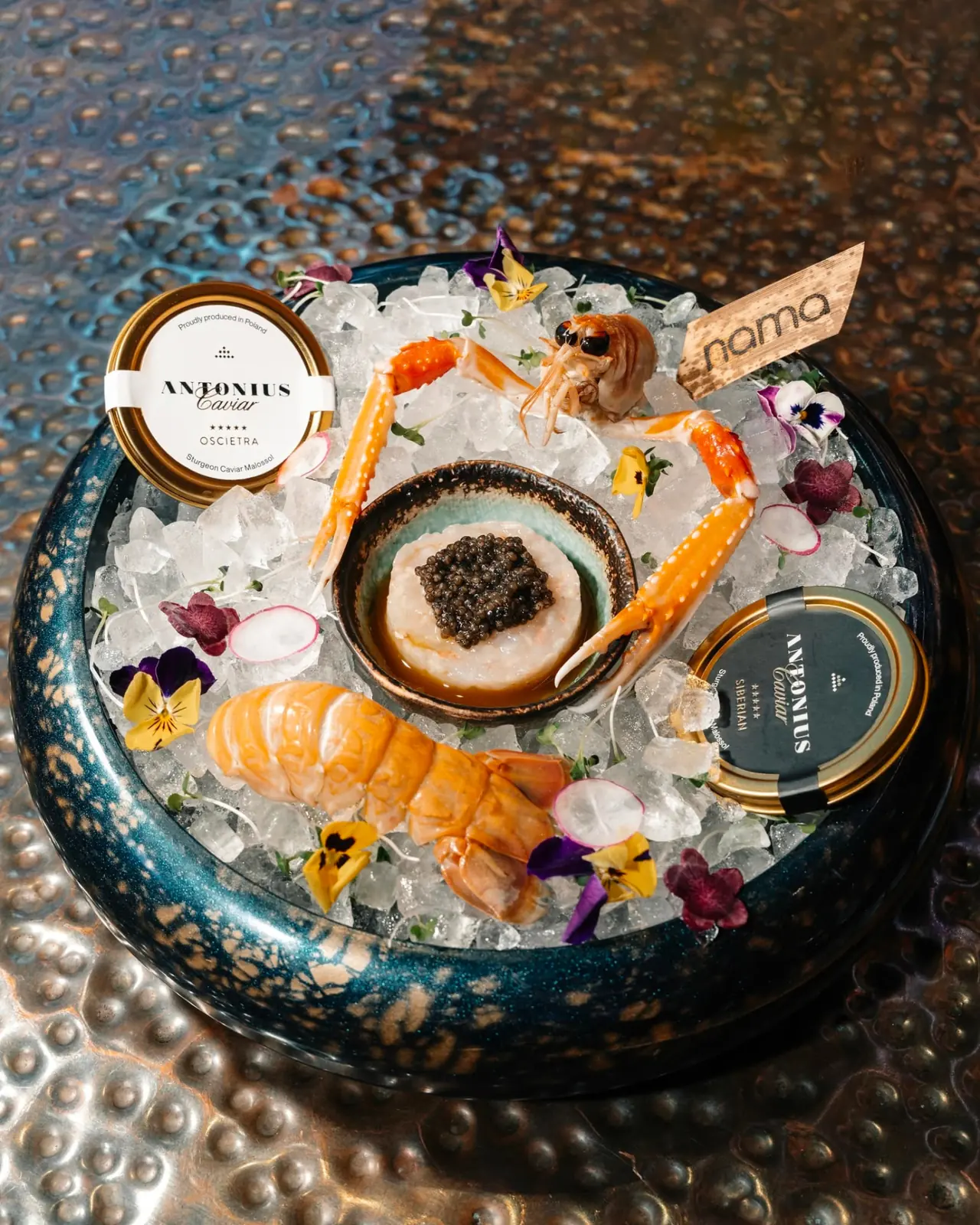 NAMA seafood platter on ice with langoustine, king crab and Antonius caviar